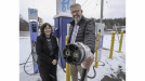 Photo of Minister Lohr holding EV charger, with Juanita Spencer, CEO, Nova Scotia Federation of Municipalities