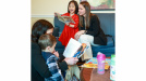 Photo of a child reading to Education and Early Childhood Development Minister Becky Druhan 