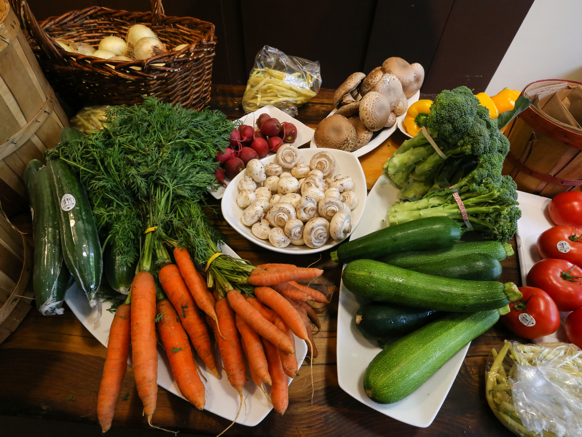 photo showing a range of local produce including carrots, cucumber, broccoli and tomato
