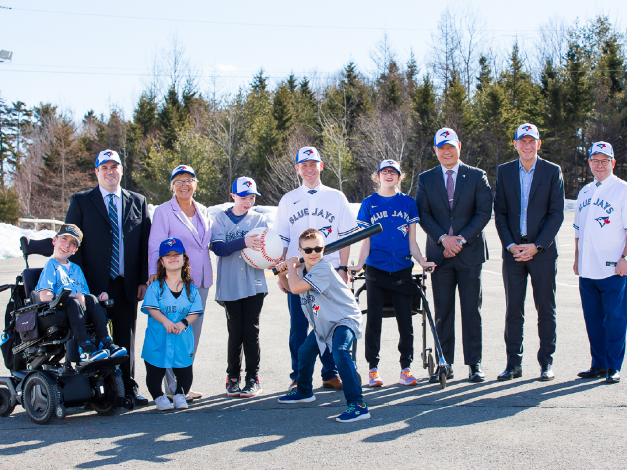 Young athletes from the Jays Cares Challenger Baseball program with (L-R): Randy Crouse, Challenger Baseball National Coordinator; Barbara Adams, Minister of Seniors and Long Term Care; Colton LeBlanc, Minister of Service Nova Scotia; Stan Cho, Ontario Minister of Long Term Care; James Dodds, Chair, Jays Cares Foundation’s board of directors; and Doug Downey, Ontario Attorney General