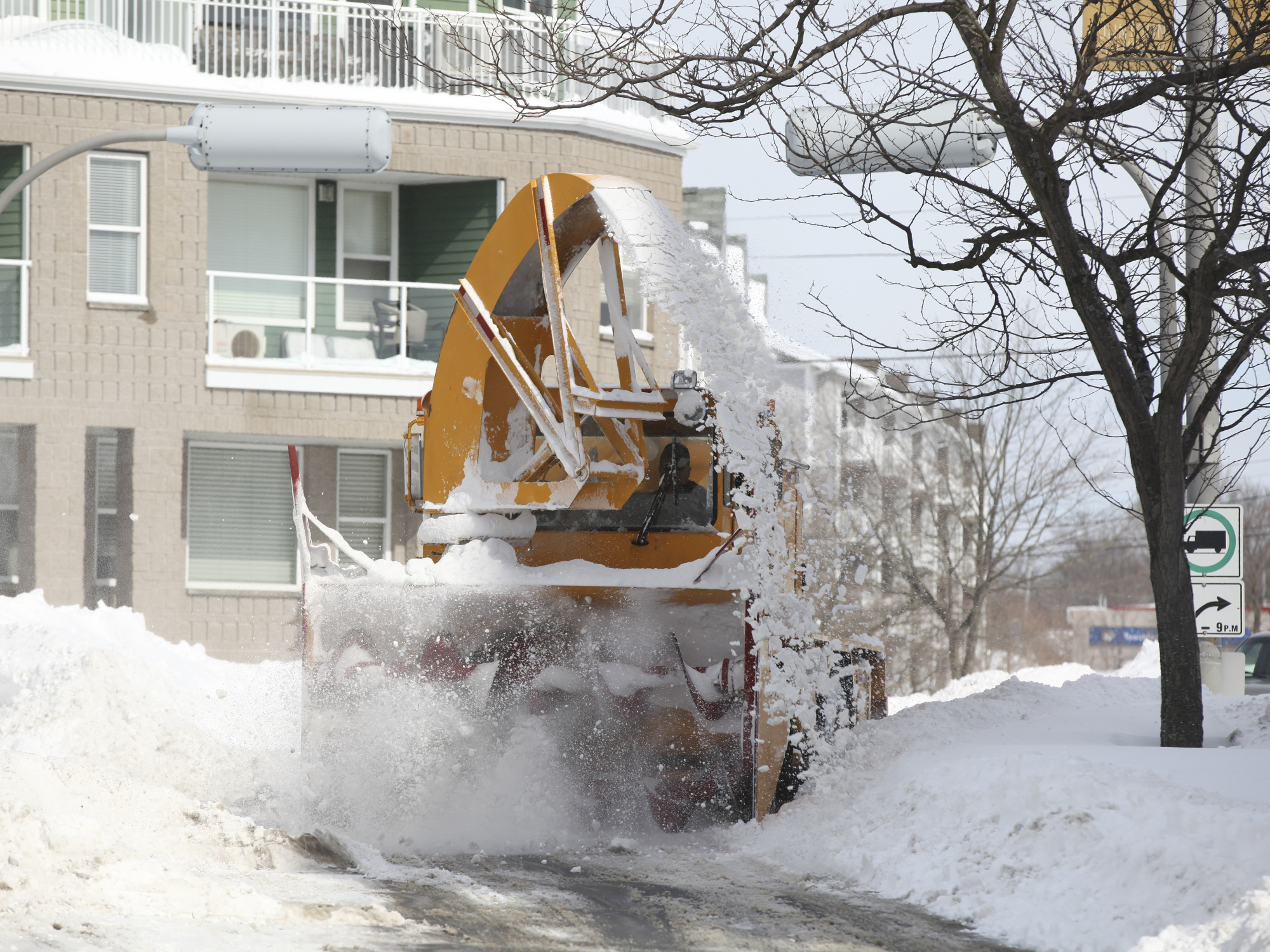 A plow moves snow