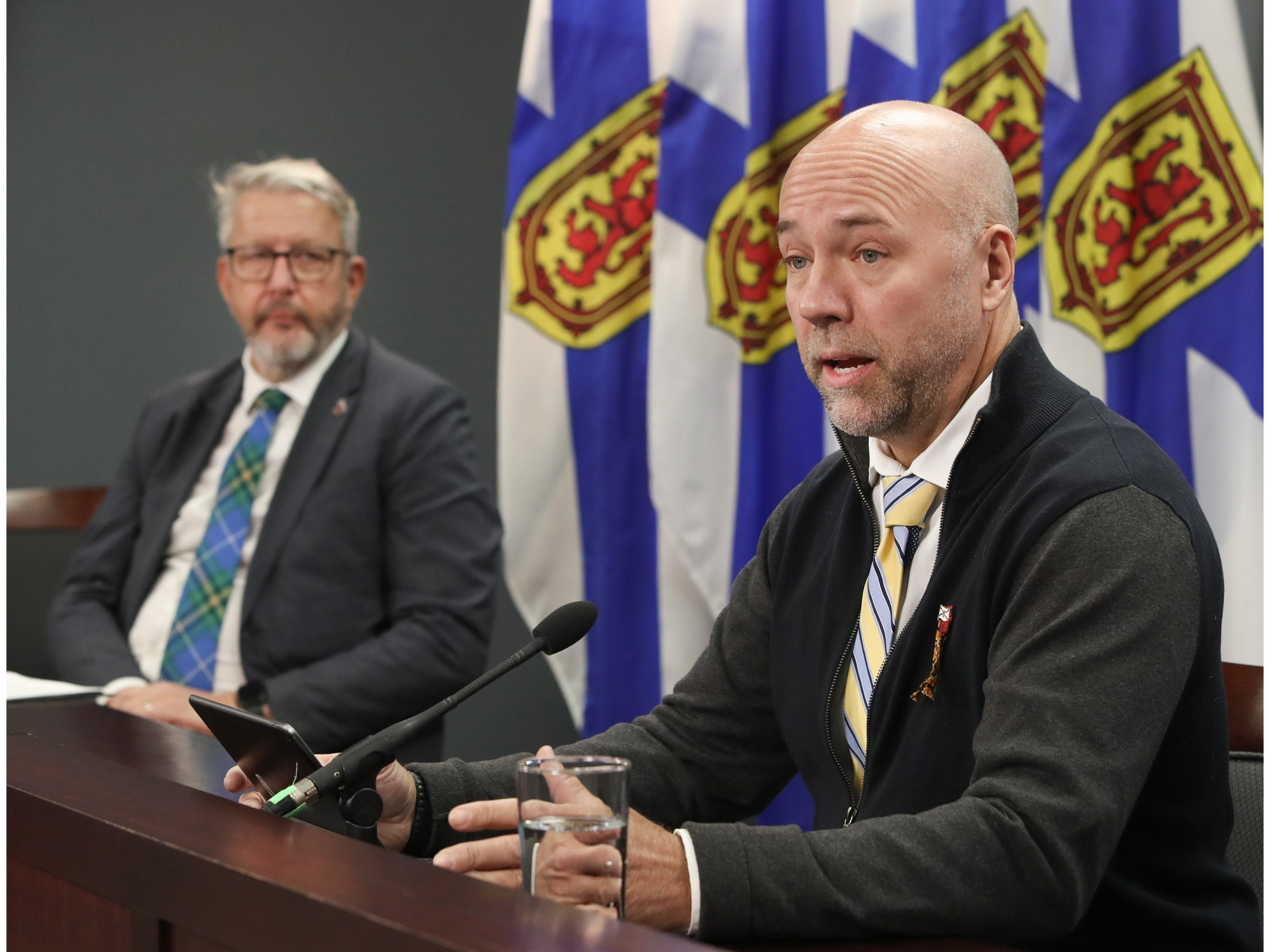 MP Andy Fillmore and Minister John Lohr speaking at table