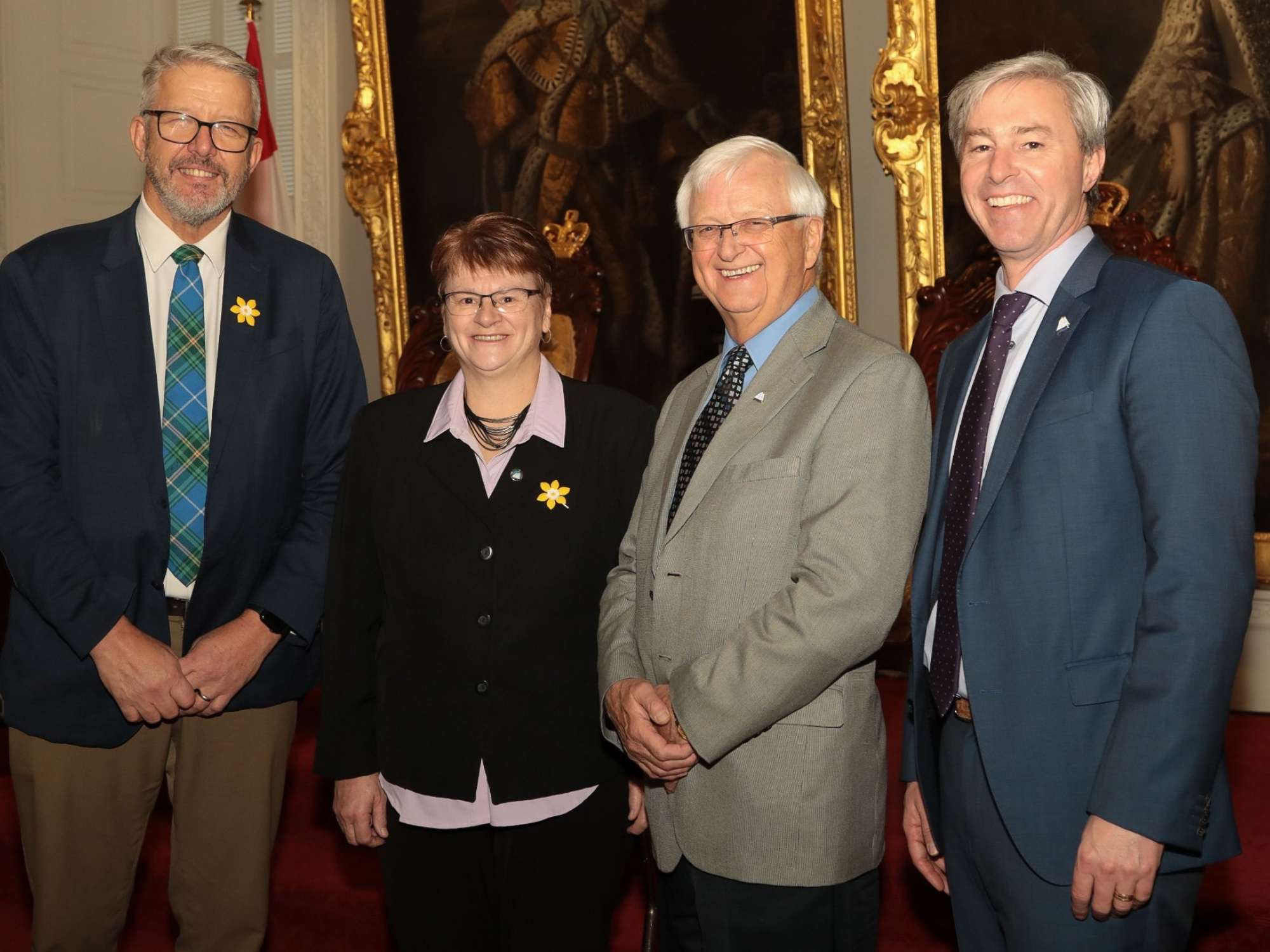 Photo of Municipal Affairs and Housing Minister John Lohr; Carolyn Boliver Getson, President of the Nova Scotia Federation of Municipalities (NSFM) and Mayor of the Municipality of the District of Lunenburg; Murray Scott, co-chair of the Service Exchange Renegotiation and Municipal Government Act Review Committee and Mayor of the Municipality of Cumberland; and Premier Tim Houston