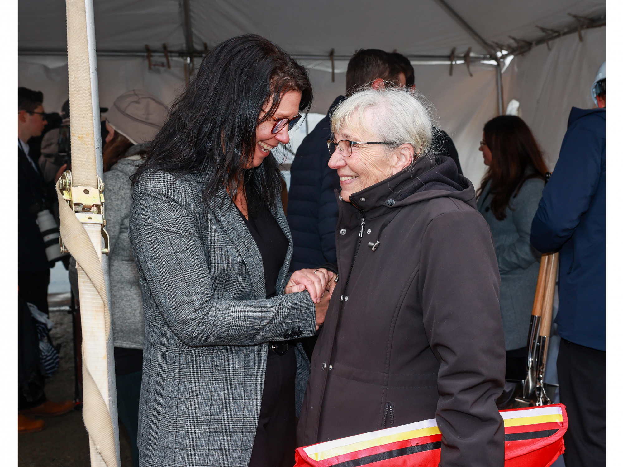 Photo of Health and Wellness Minister Michelle Thompson shaking handed with Elder Marlene Companion