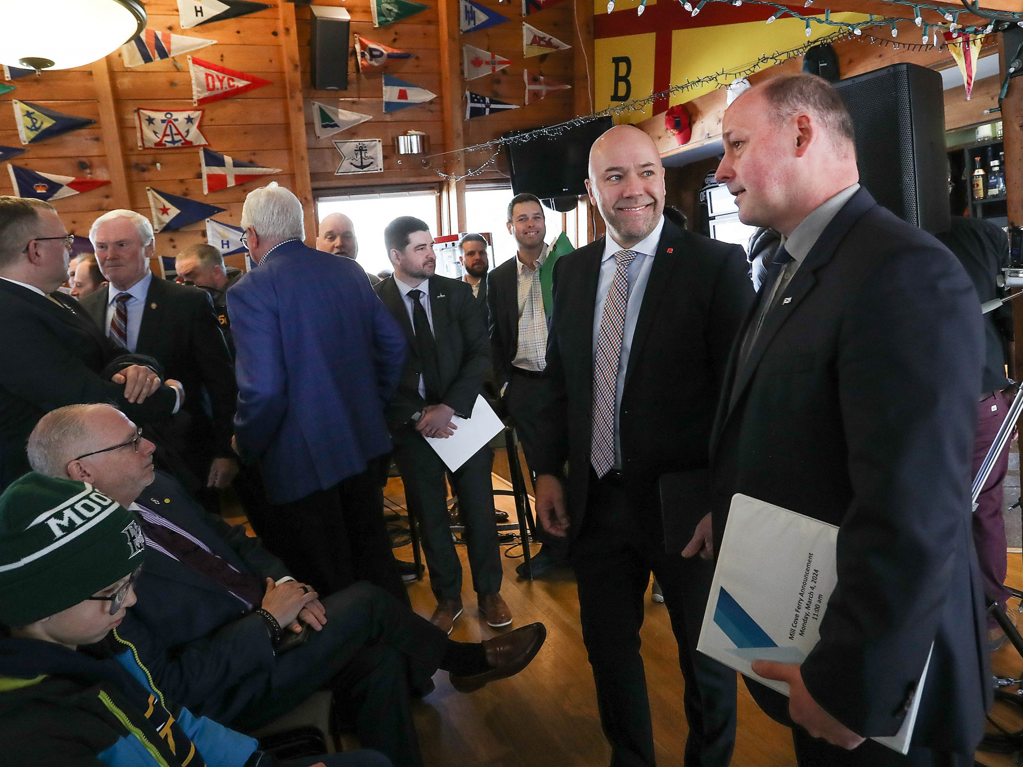 Environment and Climate Change Minister Timothy Halman speaks with guests at the Bedford Basin Yacht Club after a funding announcement for the new Mill Cove to Halifax ferry service