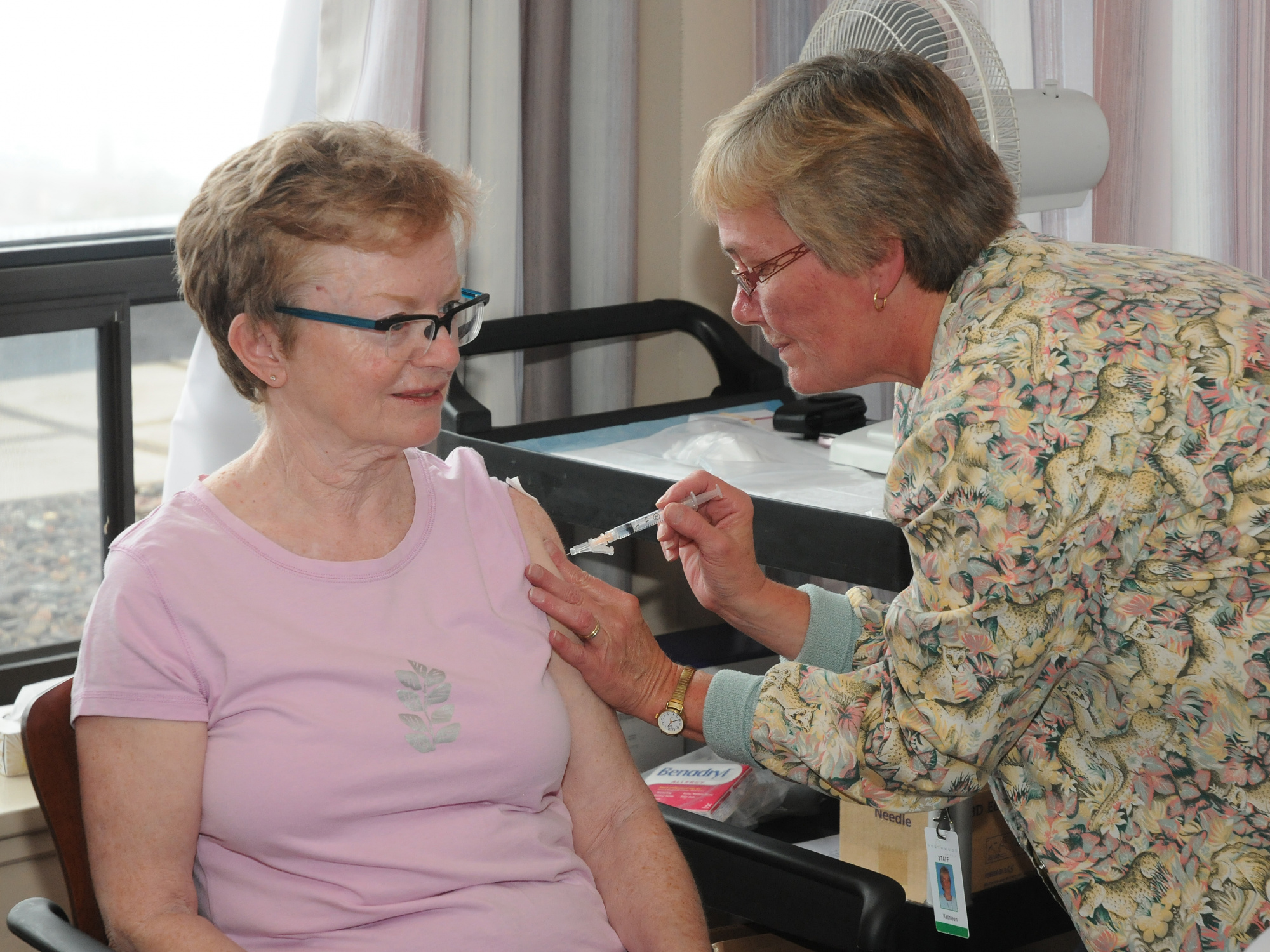 A senior receives her COVID-19 vaccine 