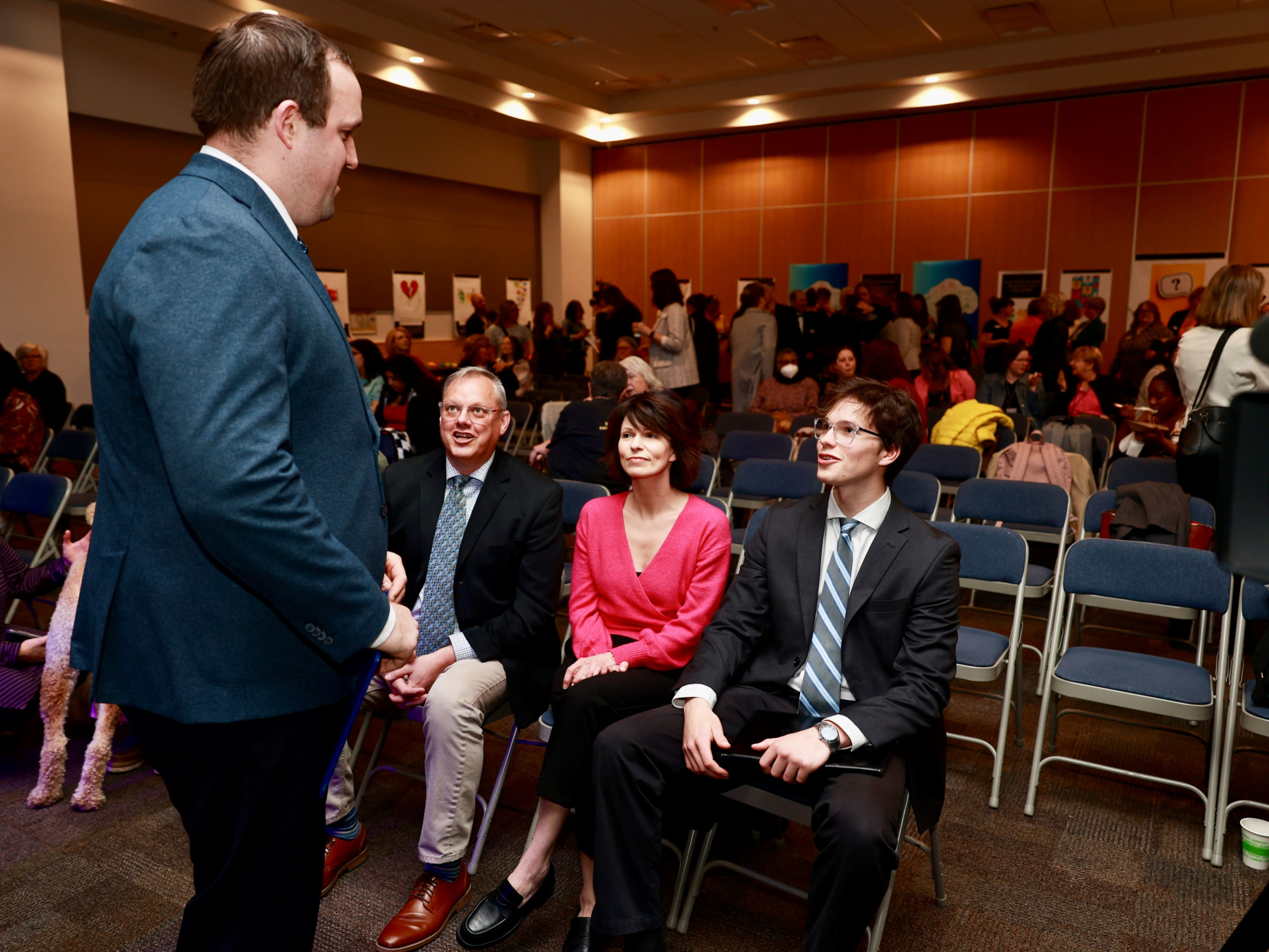 Photo of Brian Comer, Minister of Addictions and Mental Health, speaks with young people at an announcement