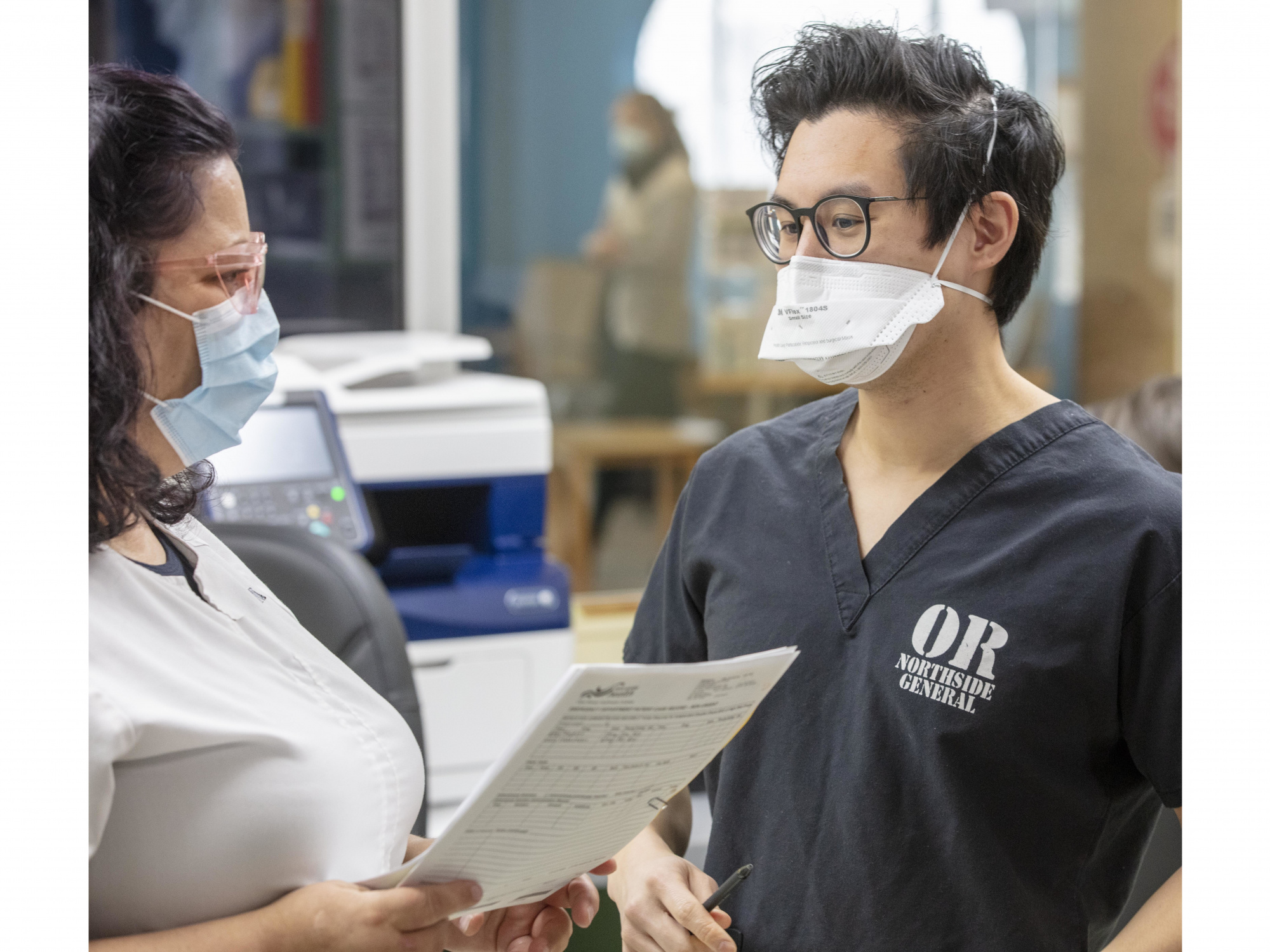 Photo of a doctor consulting with a registered nurse 