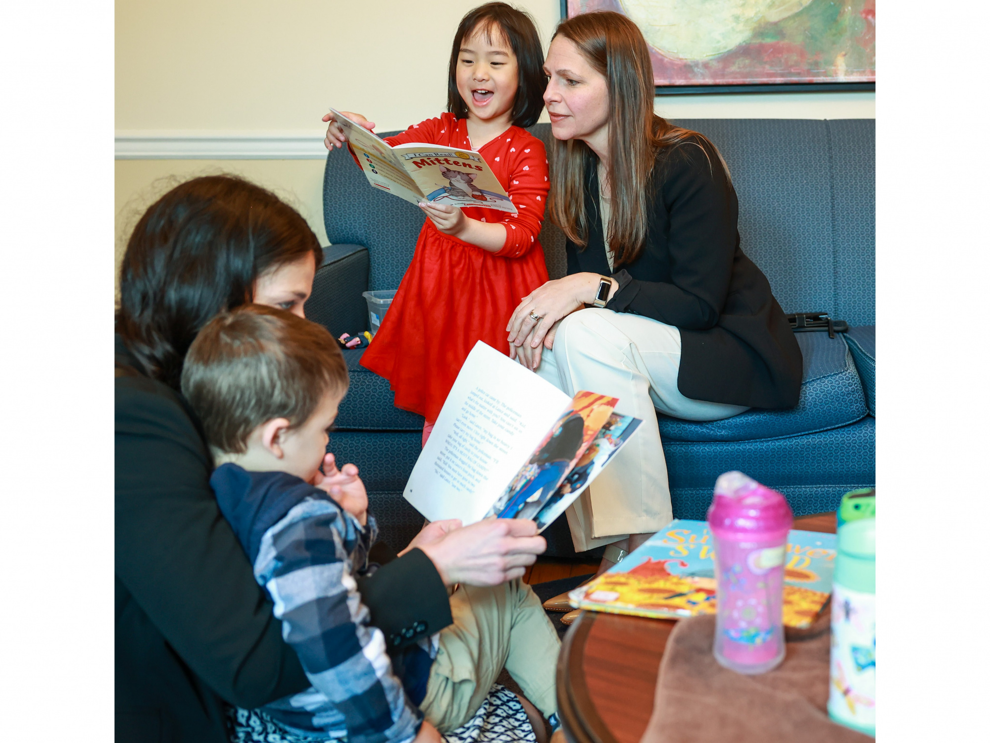 Photo of a child reading to Education and Early Childhood Development Minister Becky Druhan 