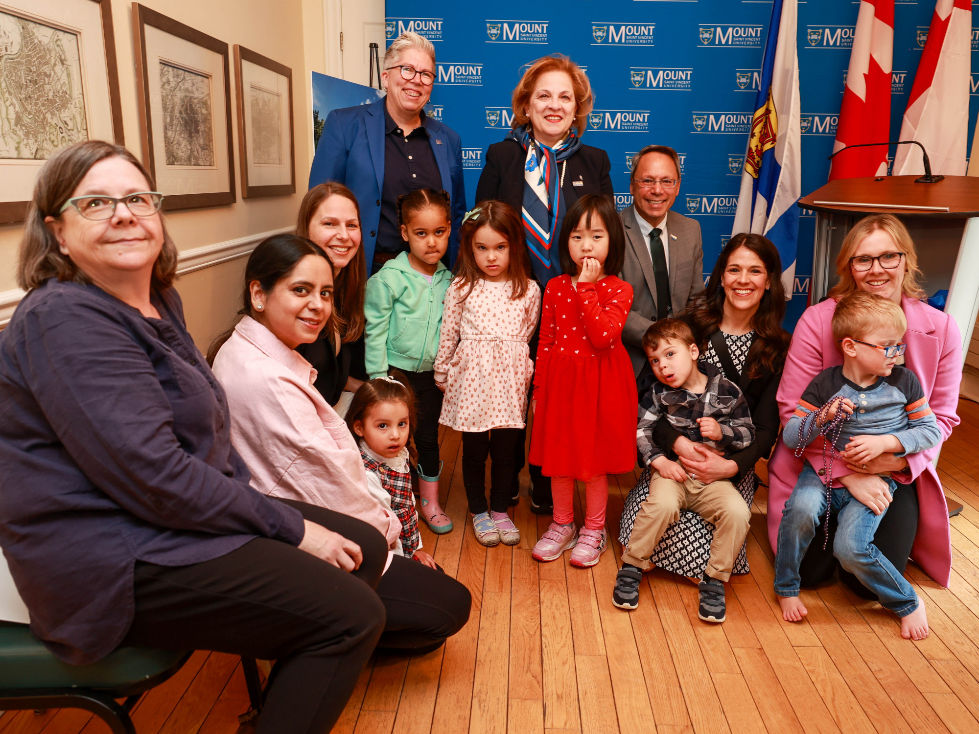 Photo of ministers and children after a child-care facility expansion announcement