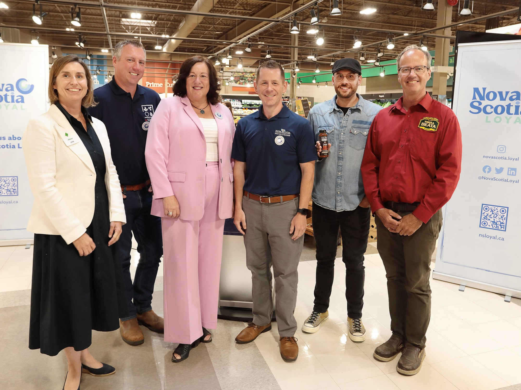 Photo of Agriculture Minister Greg Morrow, Economic Development Minister Susan Corkum-Greek and Service Nova Scotia Minister Colton LeBlanc and others at the Nova Scotia Loyal launch