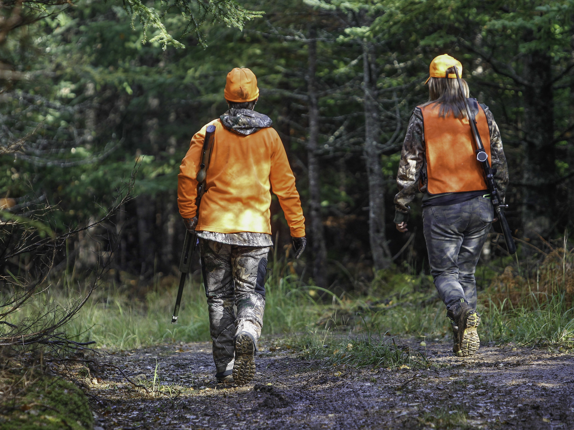 Photo of two hunters in the woods