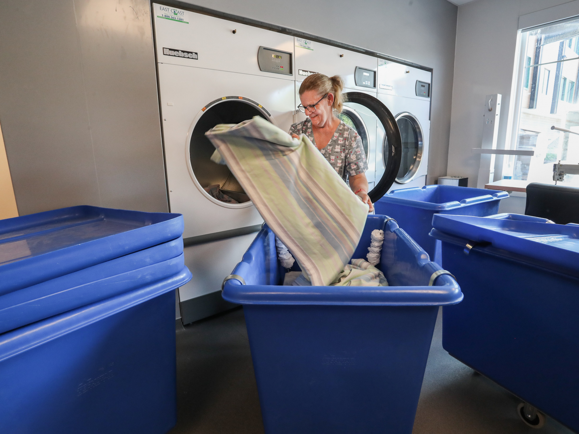 Photo of woman in laundry room at Mahone Bay Nursing Home