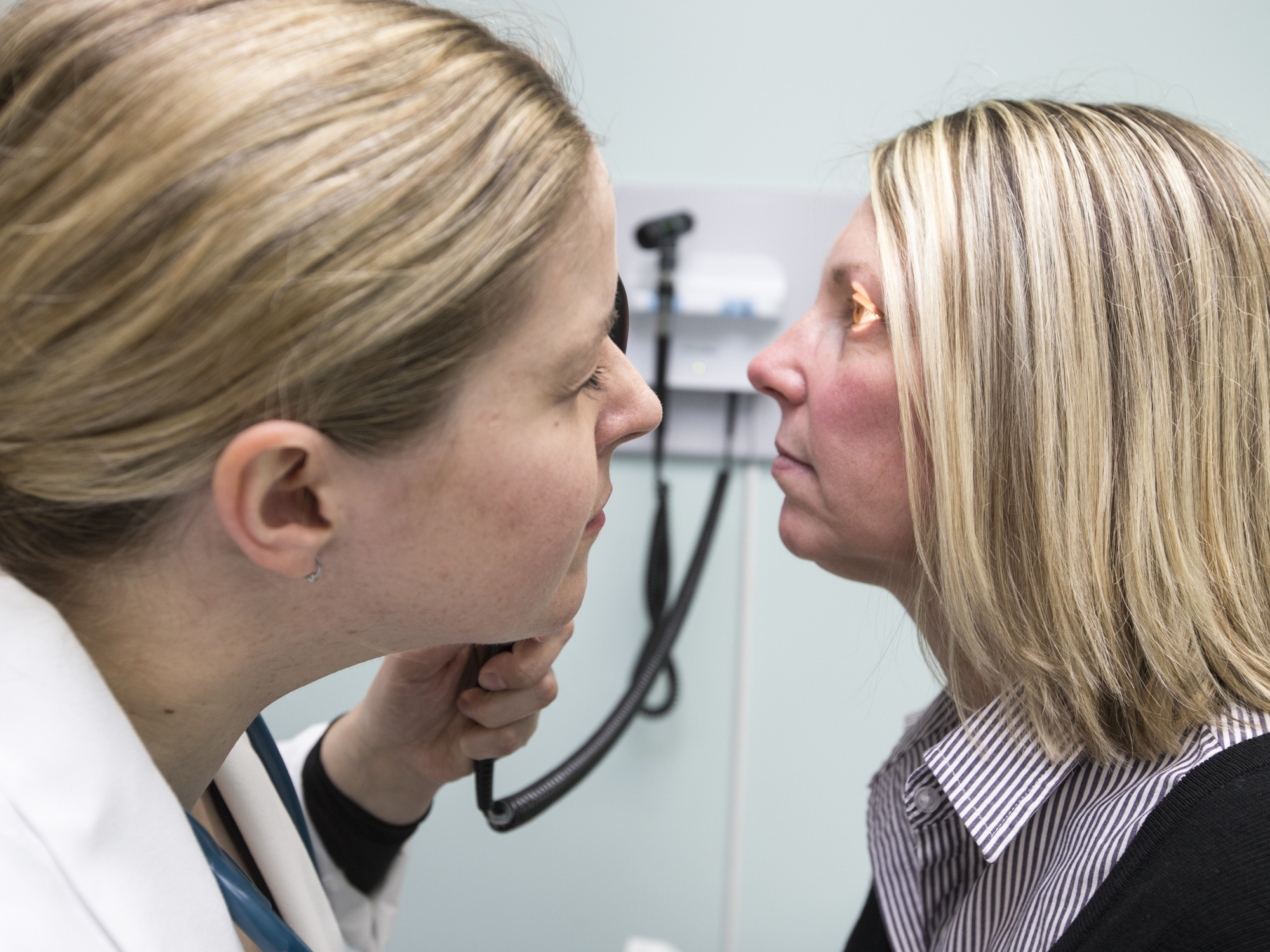 Photo of a doctor examining a patient