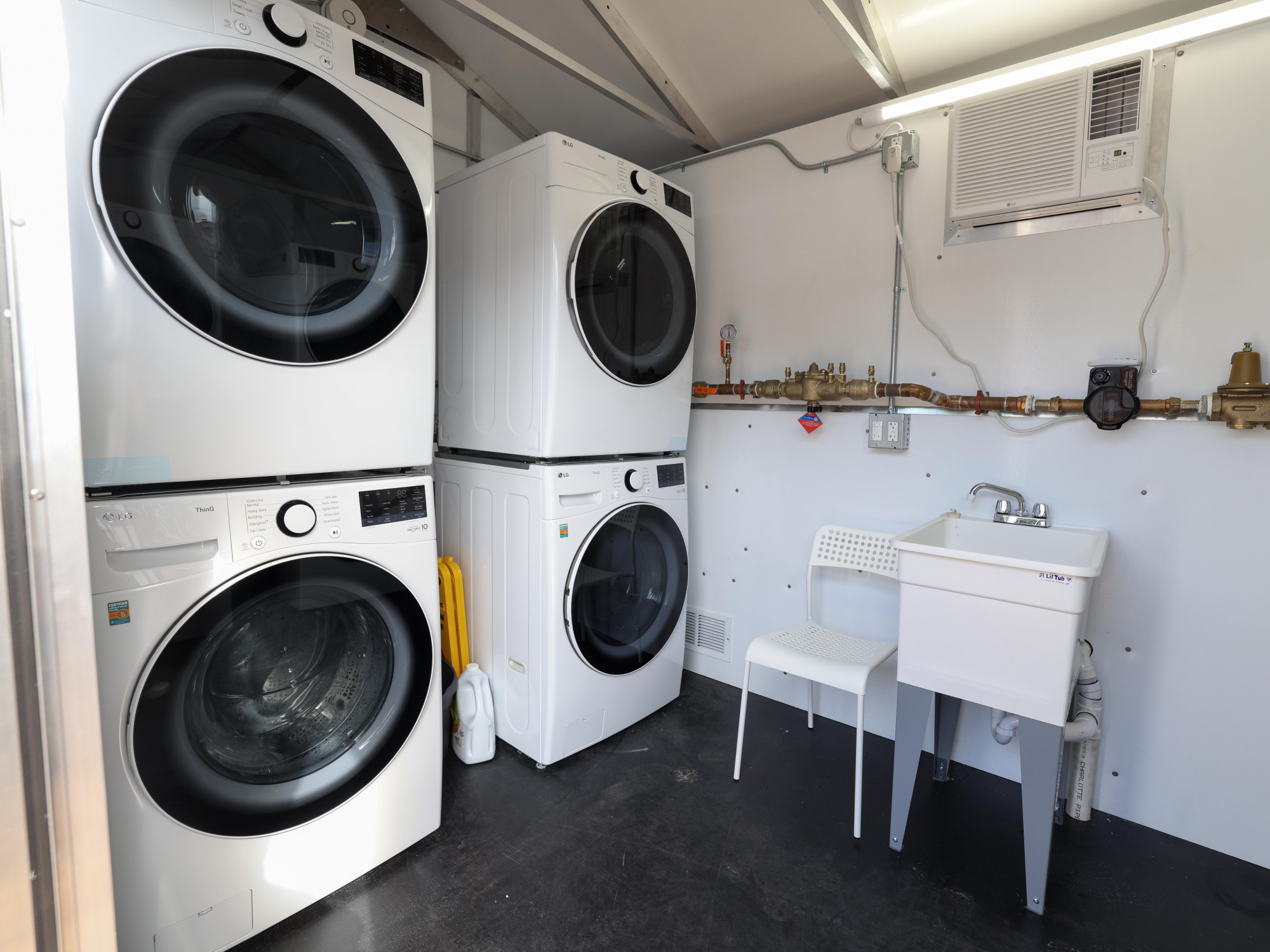 Photo of washers and dryers at a shelter village