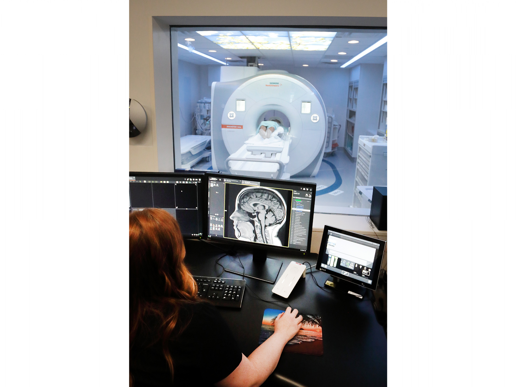 An MRI technologist in the control room of the new MRI suite at the QEII Health Sciences Centre as a patient is scanned in the new 1.5T MRI.