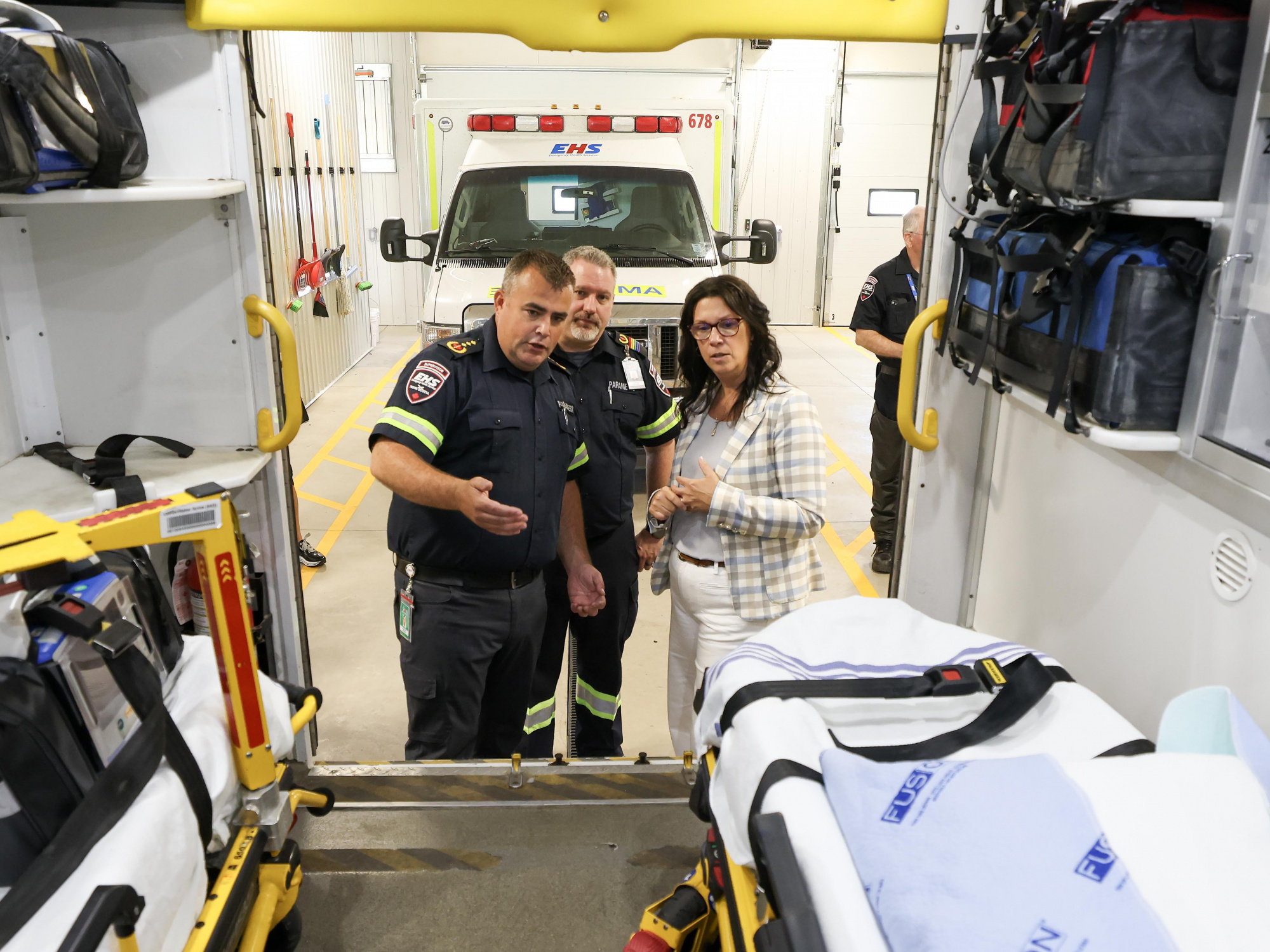 Health and Wellness Minister Michelle Thompson speaks with paramedics. (Communications Nova Scotia / File)  ---