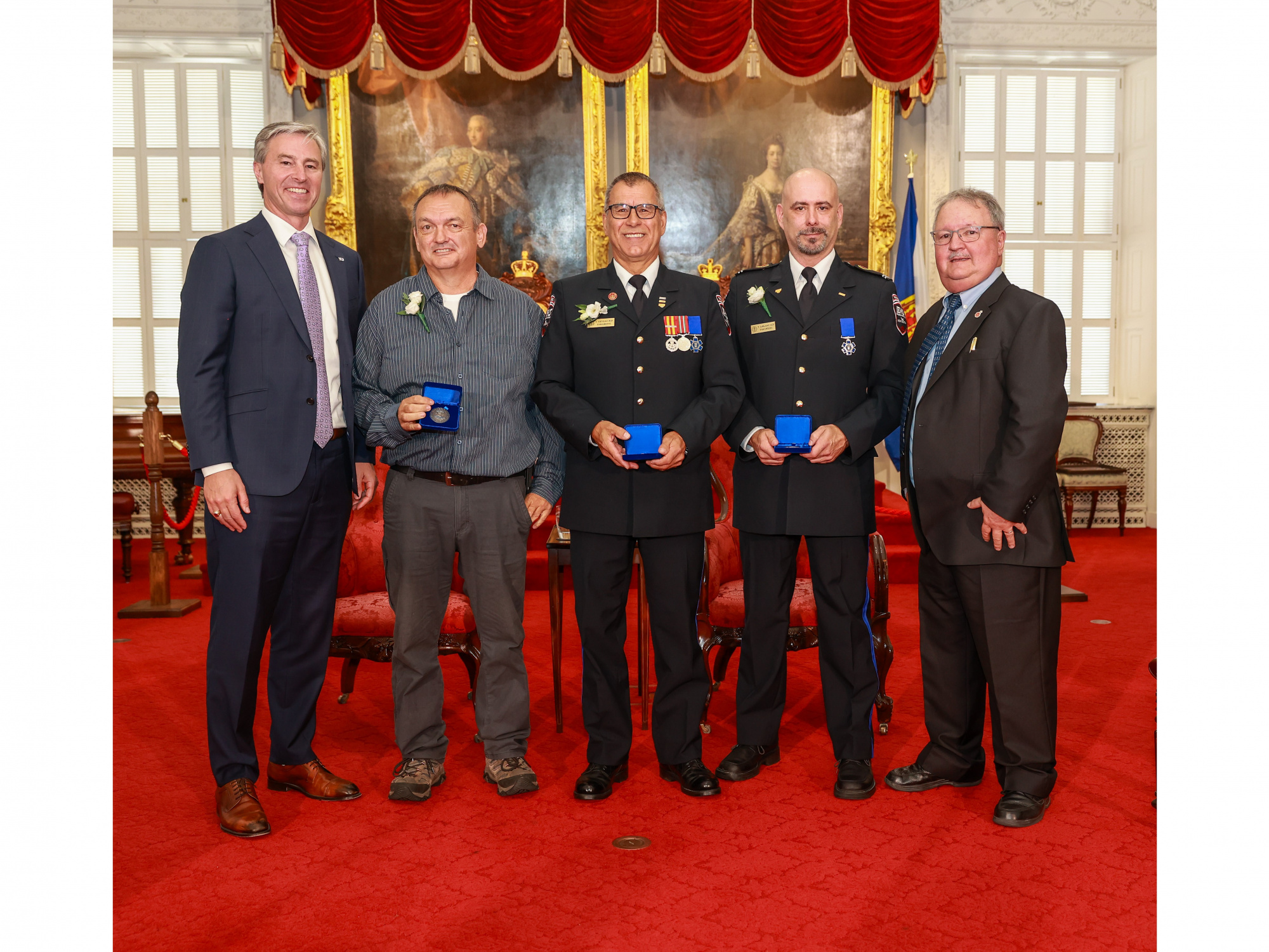 Photo of Premier Tim Houston; medal recipients Carl Comeau of Church Point, Carl Deveau of Saulnierville and Terrence Leblanc of Saulnierville; Tom Steele, Chair, Medal of Bravery Advisory Committee