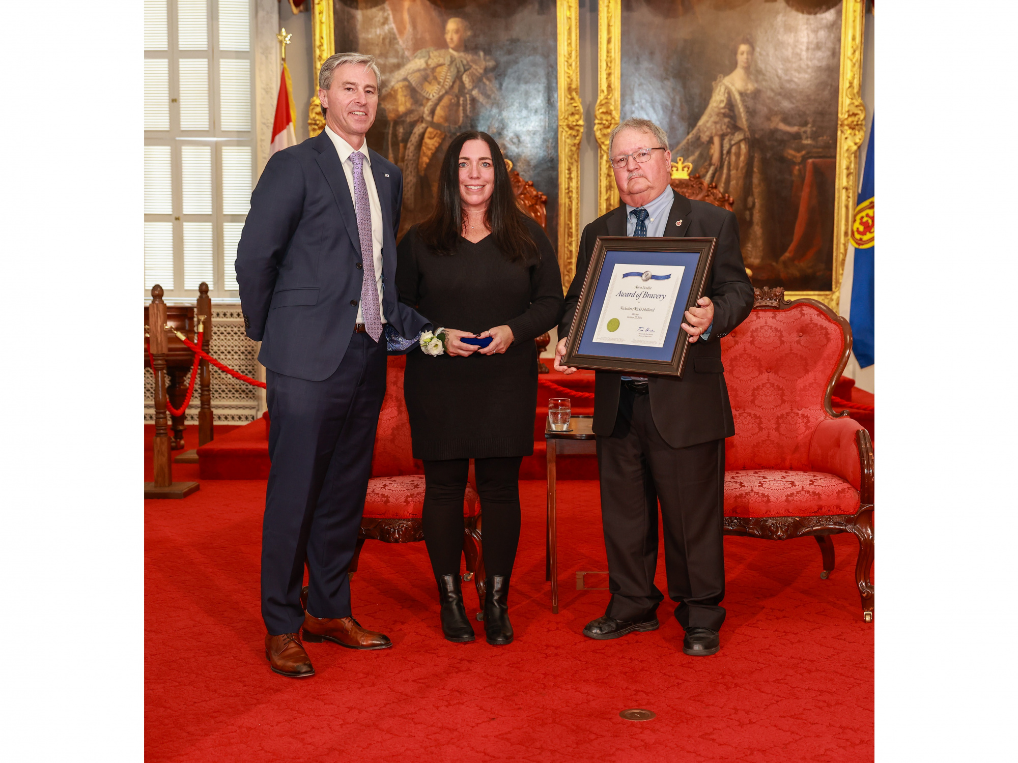 Photo of Michelle Stewart on behalf of 2024 Medal of Bravery recipient Nicholas Holland of Ellershouse (awarded posthumously), and Medal of Bravery Advisory Committee Chair Tom Steele