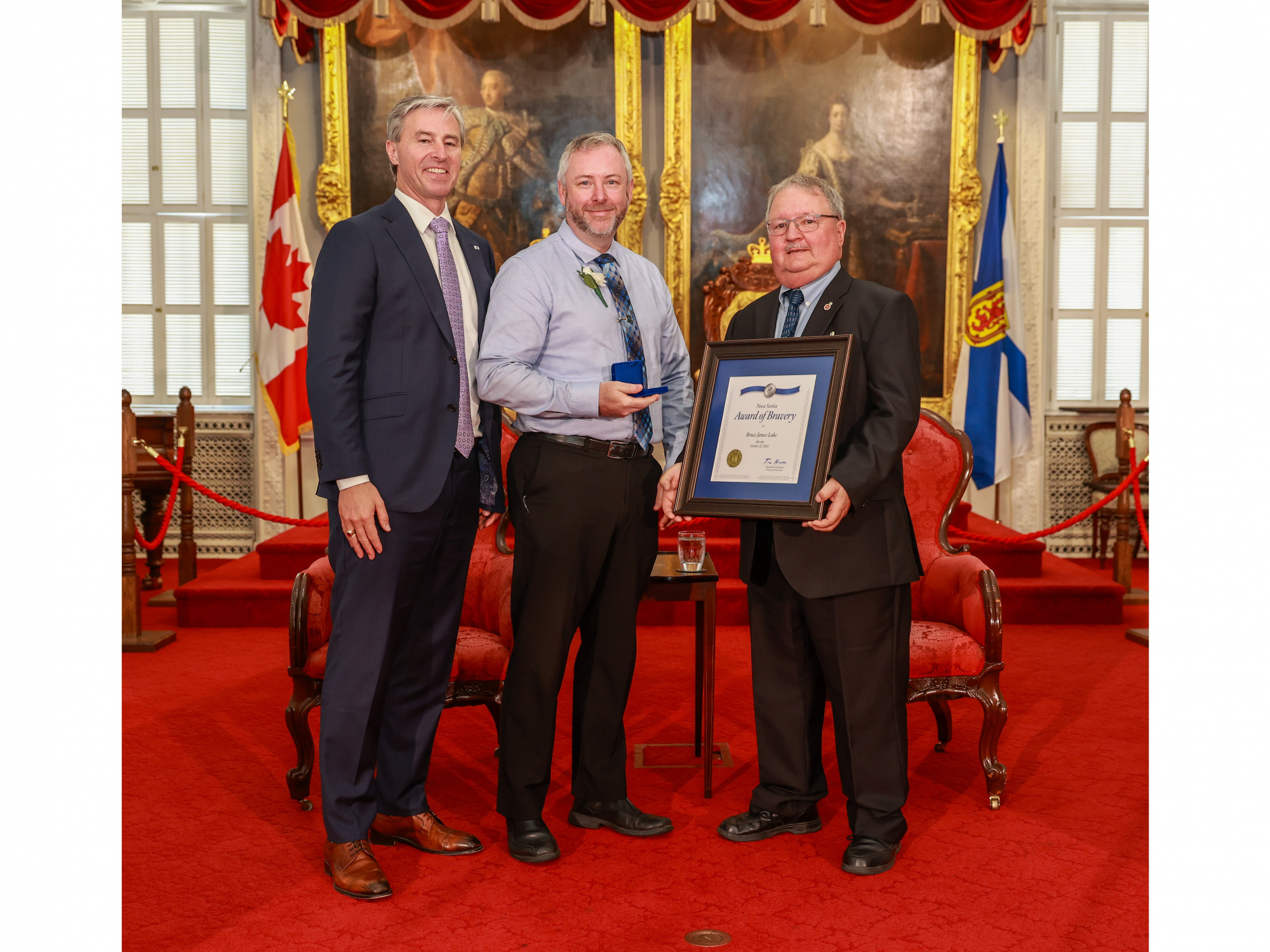 Photo of 2024 Medal of Bravery award recipient Bruce Lake with Premier Tim Houston and Medal of Bravery Advisory Committee Chair Tom Steele