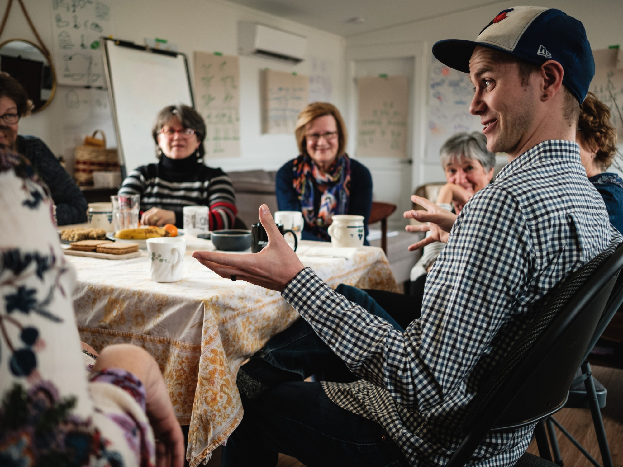 People around seated at a table in Gaelic Immersion Program