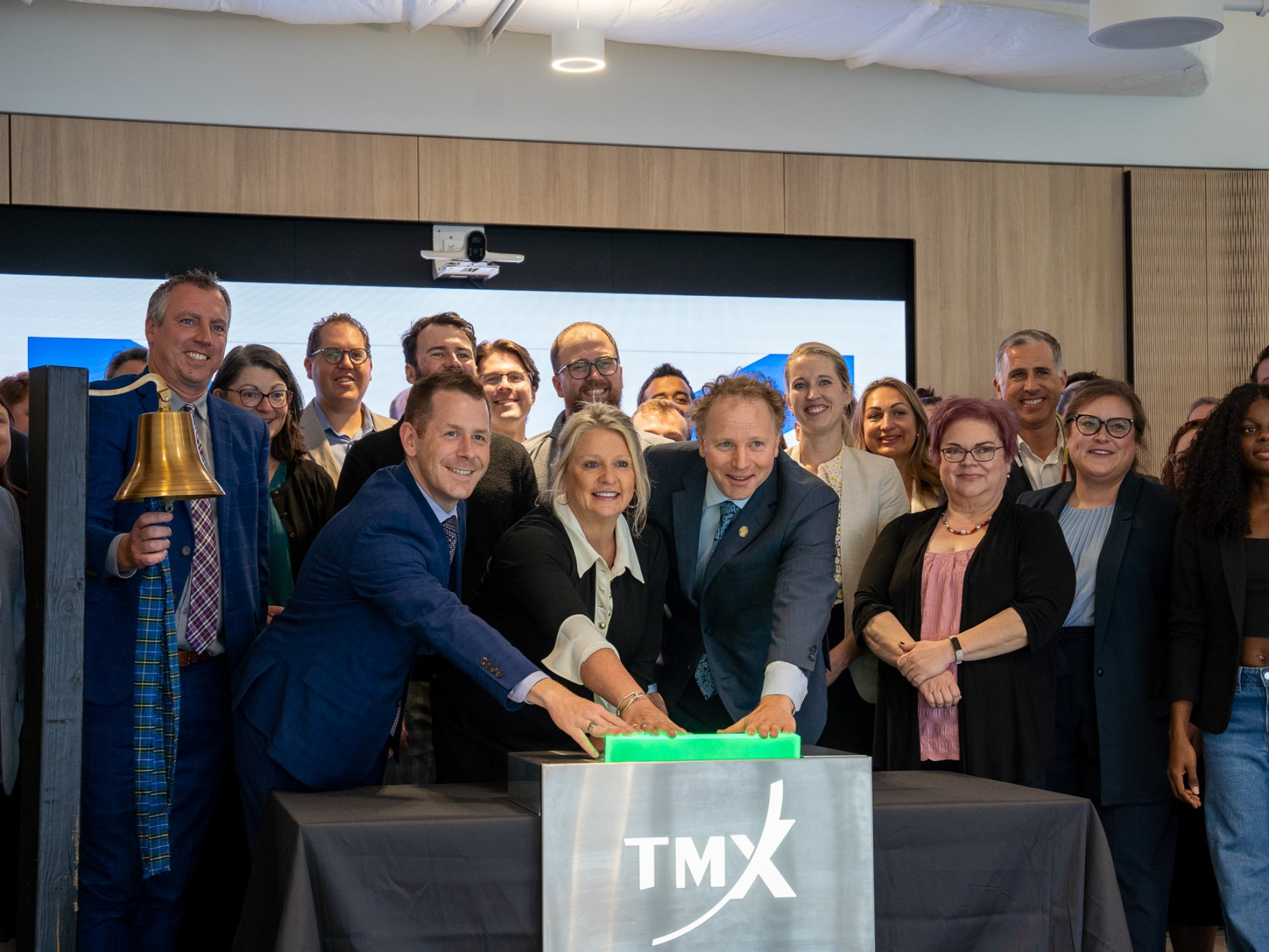 Agriculture Minister Greg Morrow rings the bell as (L-R) Service Nova Scotia Minister Colton LeBlanc, Public Works Minister Kim Masland and Deputy Premier Alan MacMaster open the Toronto Stock Exchange from the Health Innovation Hub in Halifax today, October 8. (Province of Nova Scotia)