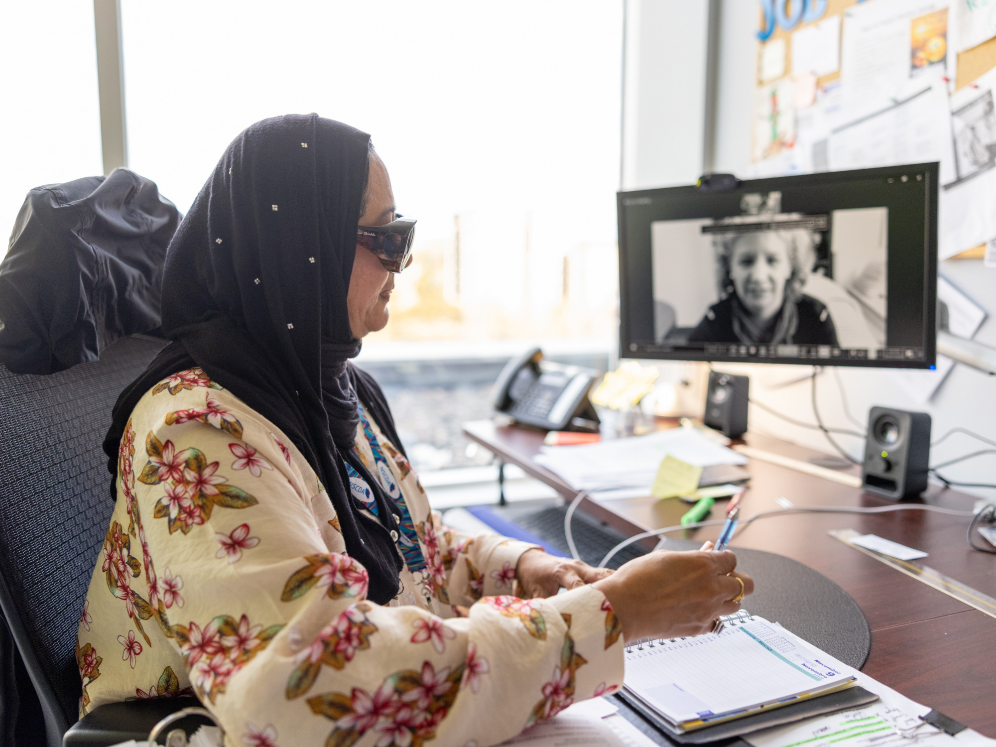 Photo of a visually impaired woman working in an office