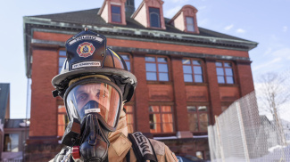 Firefighter wearing protective mask