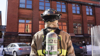 Firefighter with oxygen tank on his back