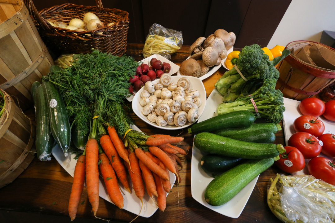 photo showing a range of local produce including carrots, cucumber, broccoli and tomato