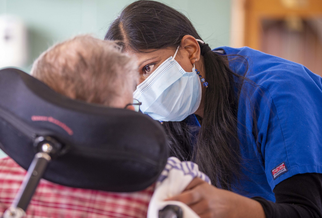 Photo of a continuing care assistant at work