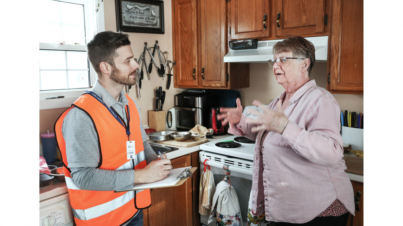 Photo of a handyman and a senior