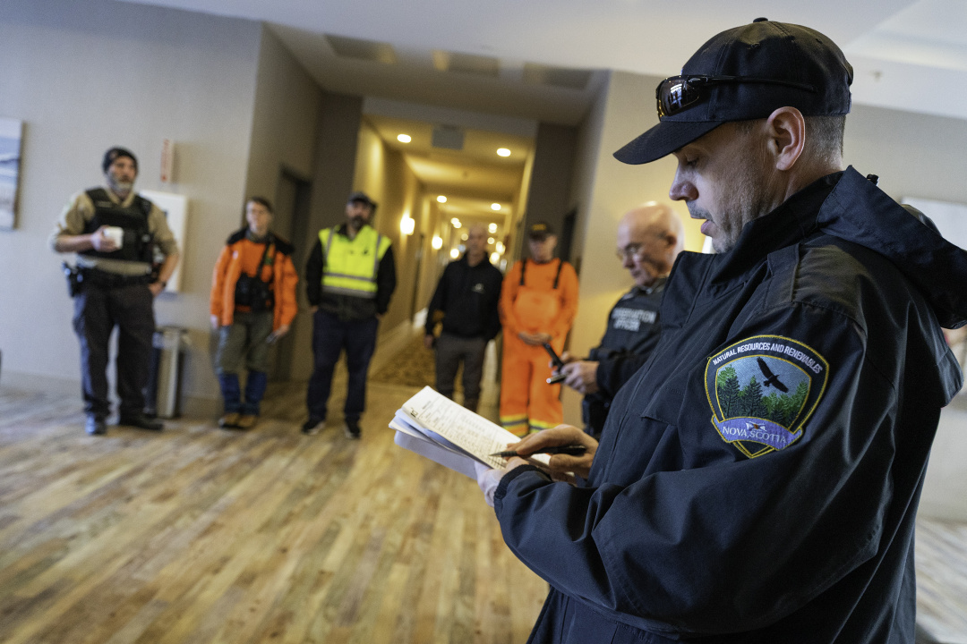 Department of Natural Resources and Renewables staff gather indoors for a meeting.