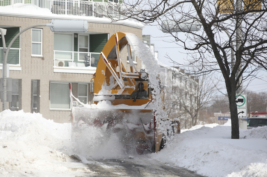 A plow moves snow