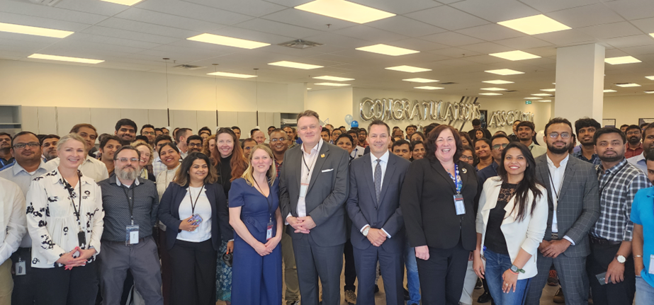 Cognizant workers gathered for photo celebrating reaching 1000 employees; Economic Development Minister Susan Corkum-Greek in photo