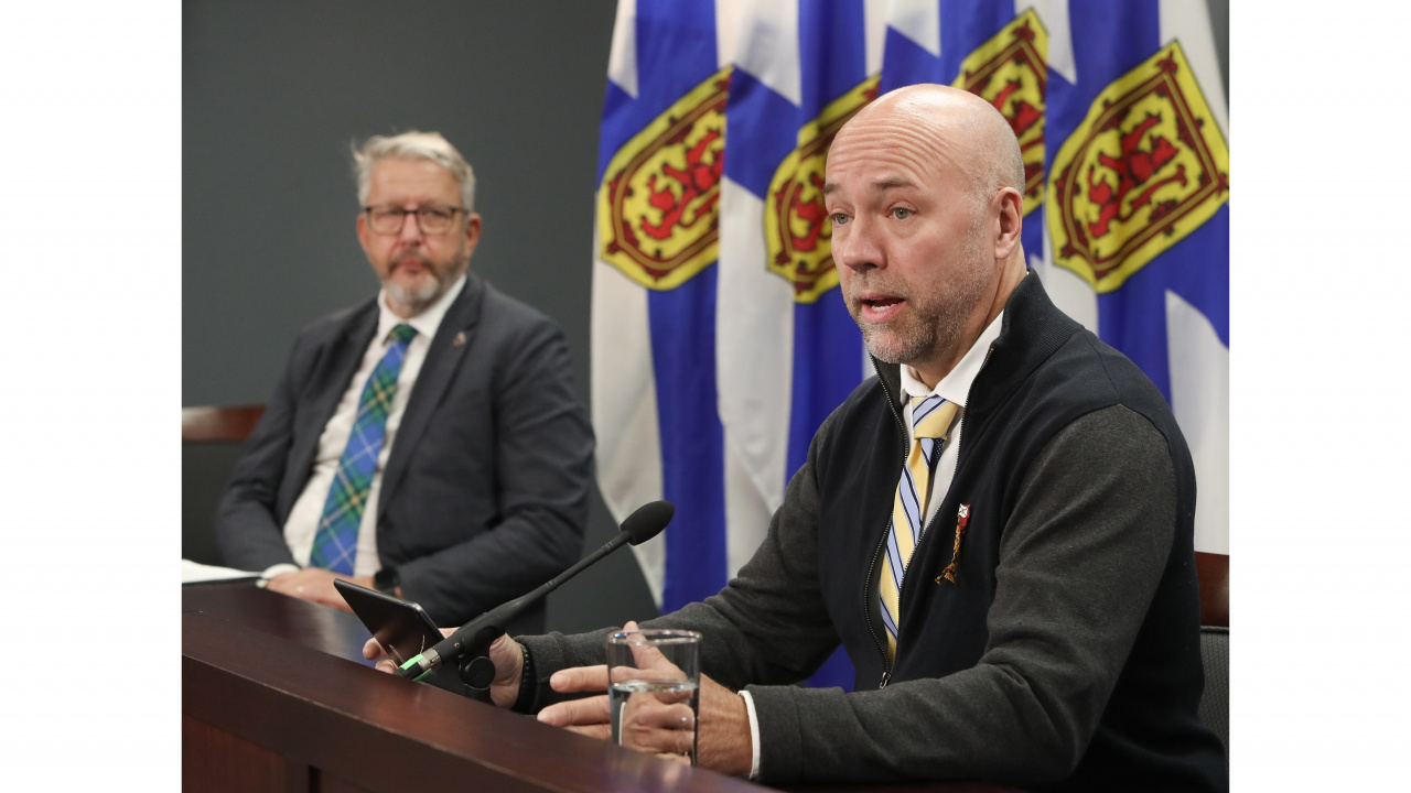 MP Andy Fillmore and Minister John Lohr speaking at table