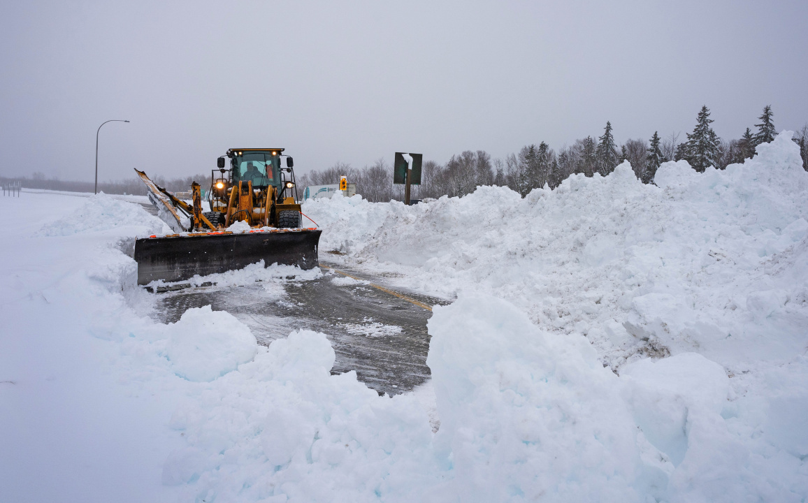 Photo of snowplow pushing snow