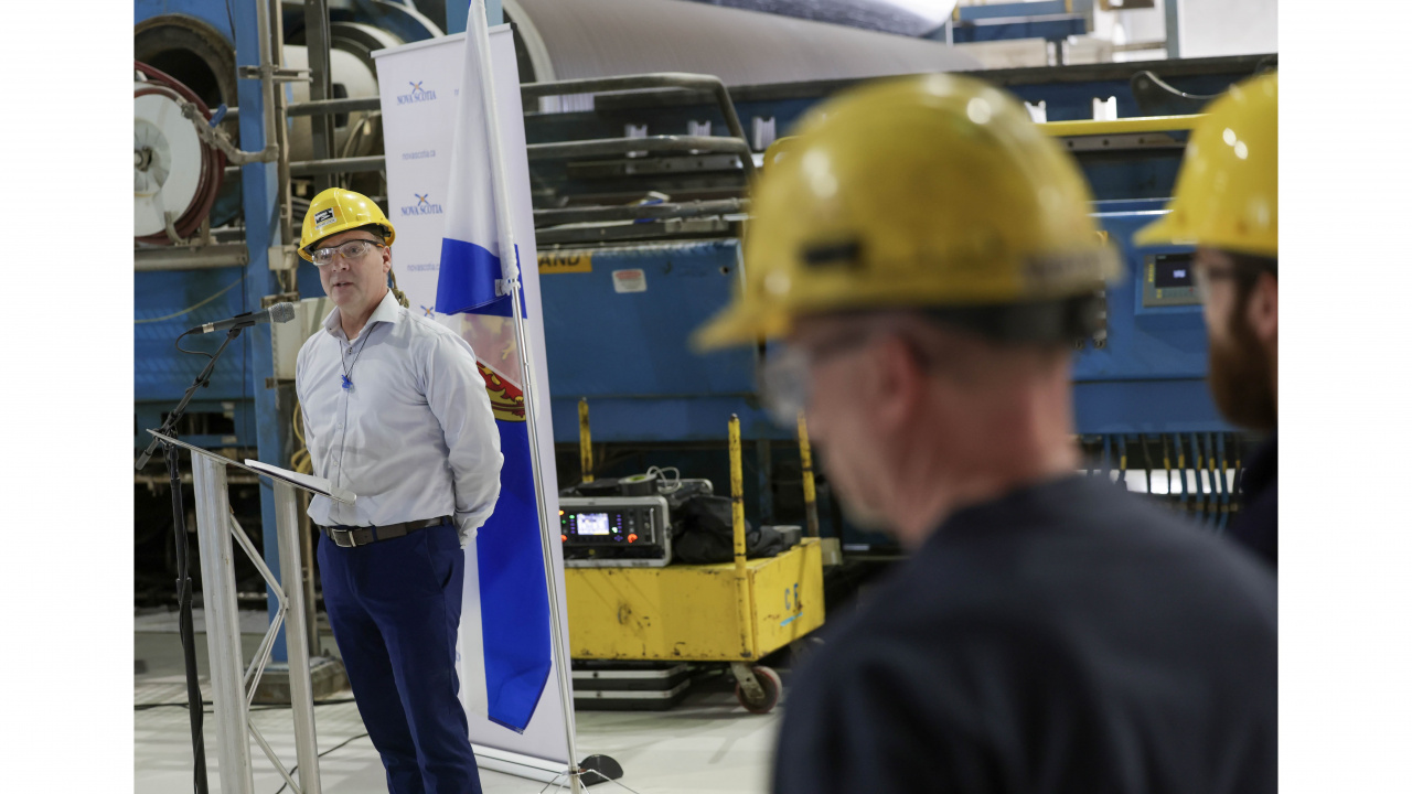 Photo of Bevan Lock, Mill Co-Manager, Port Hawkesbury Paper at a podium in the mill