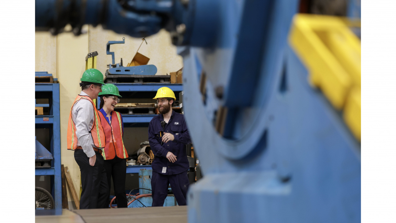 Photo of Greg Morrow, Minister of Agriculture, and Jill Balser, Minister of Labour, Skills and Immigration, and Daylan Samson electrical apprentice at Port Hawkesbury Paper