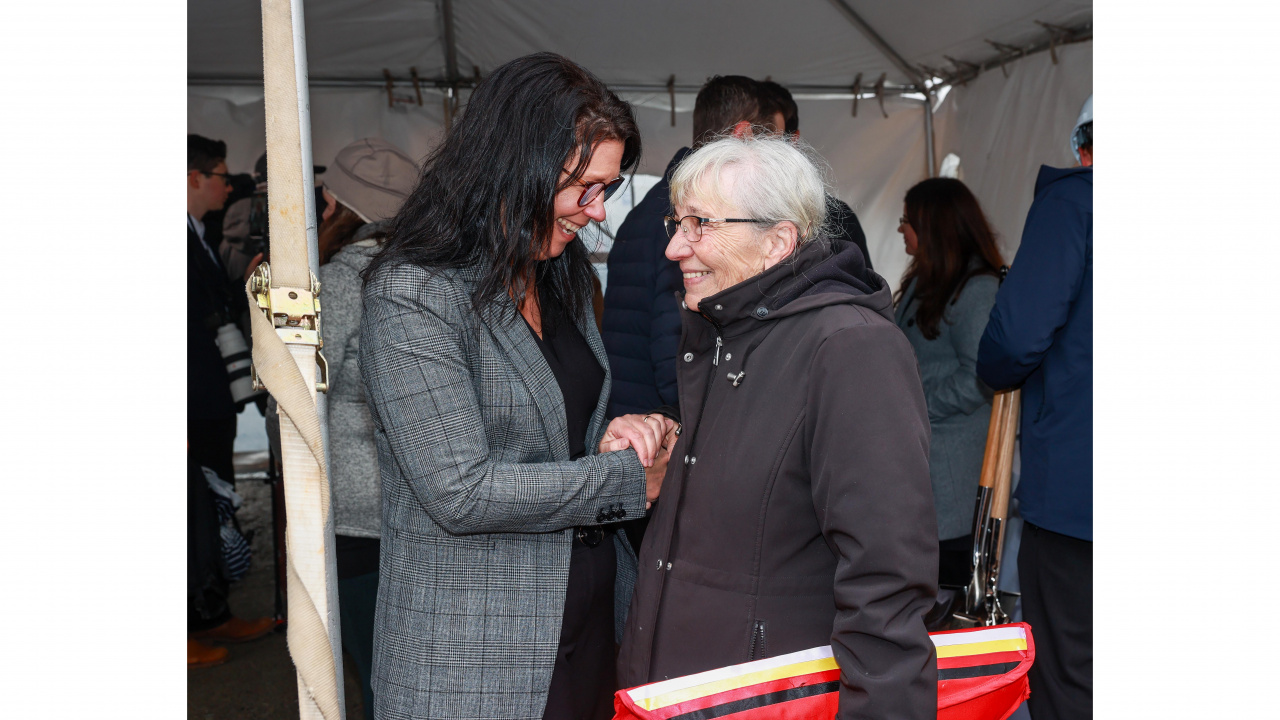 Photo of Health and Wellness Minister Michelle Thompson shaking handed with Elder Marlene Companion