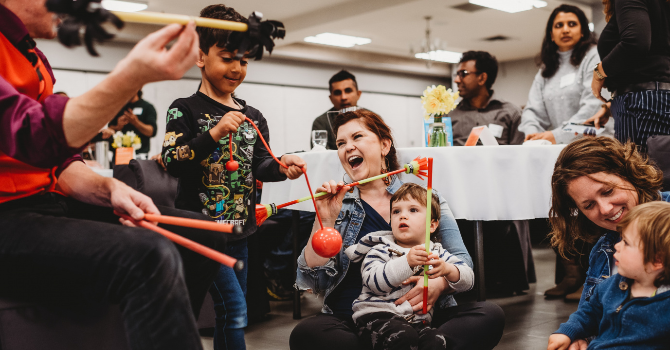 Children and caregivers play during a welcome event held in Pictou County in 202