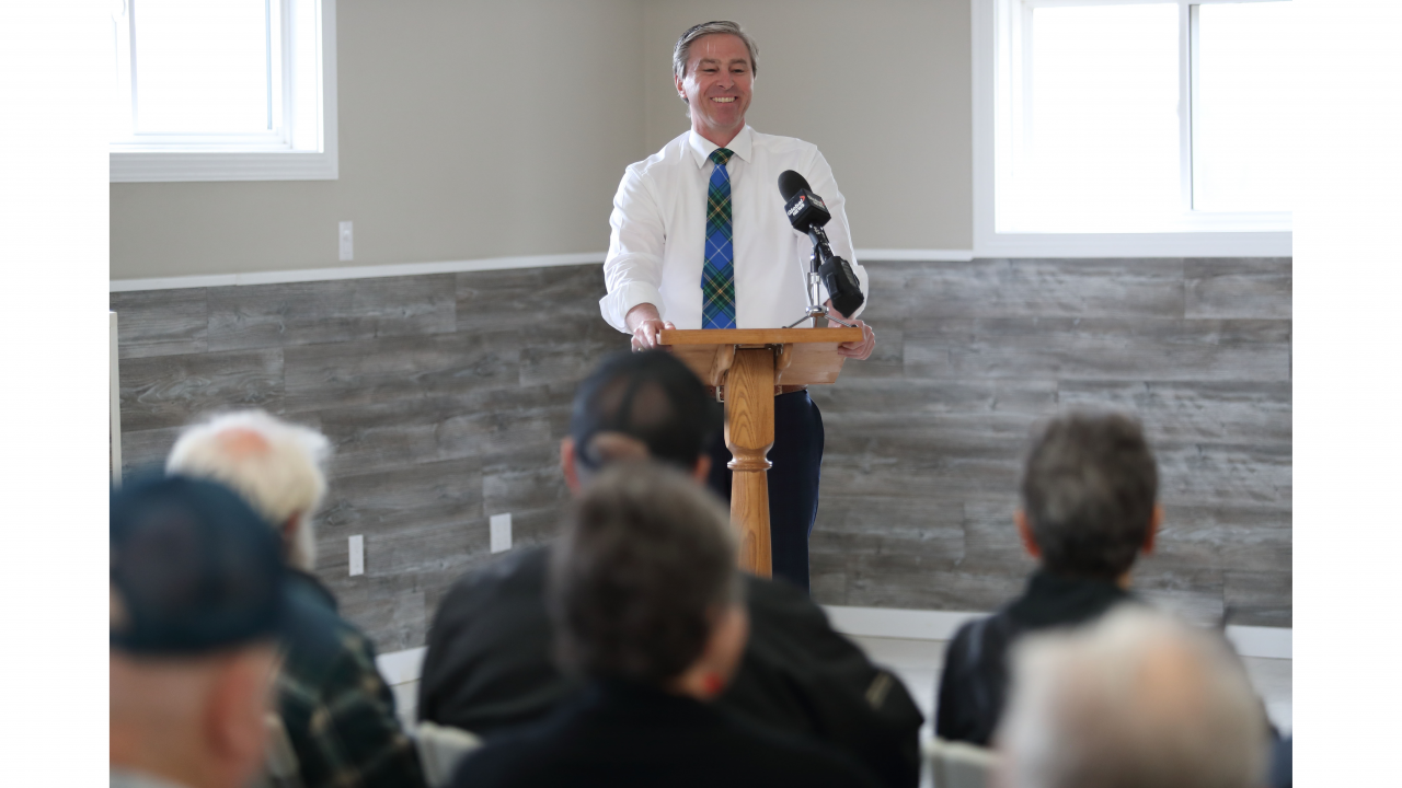 Photo of Premier Tim Houston speaking at a podium