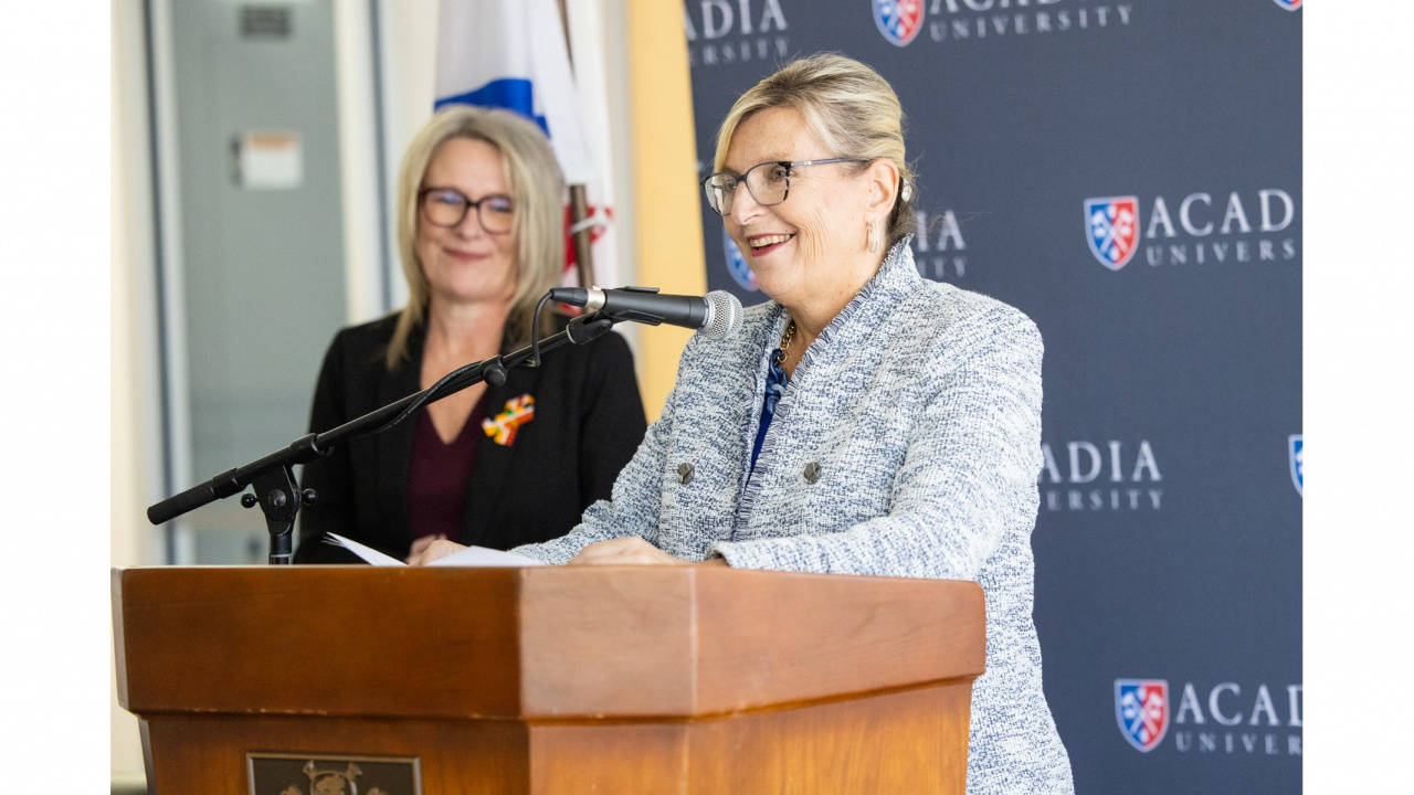 Photo of cabinet Minister Barbara Adams at a podium