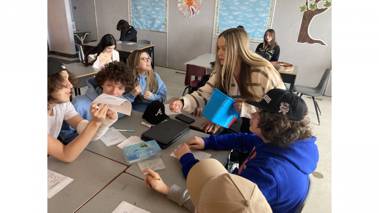 Photo of Nadine Prosper, a teacher at Sherwood Park Education Centre in Sydney, working with students 