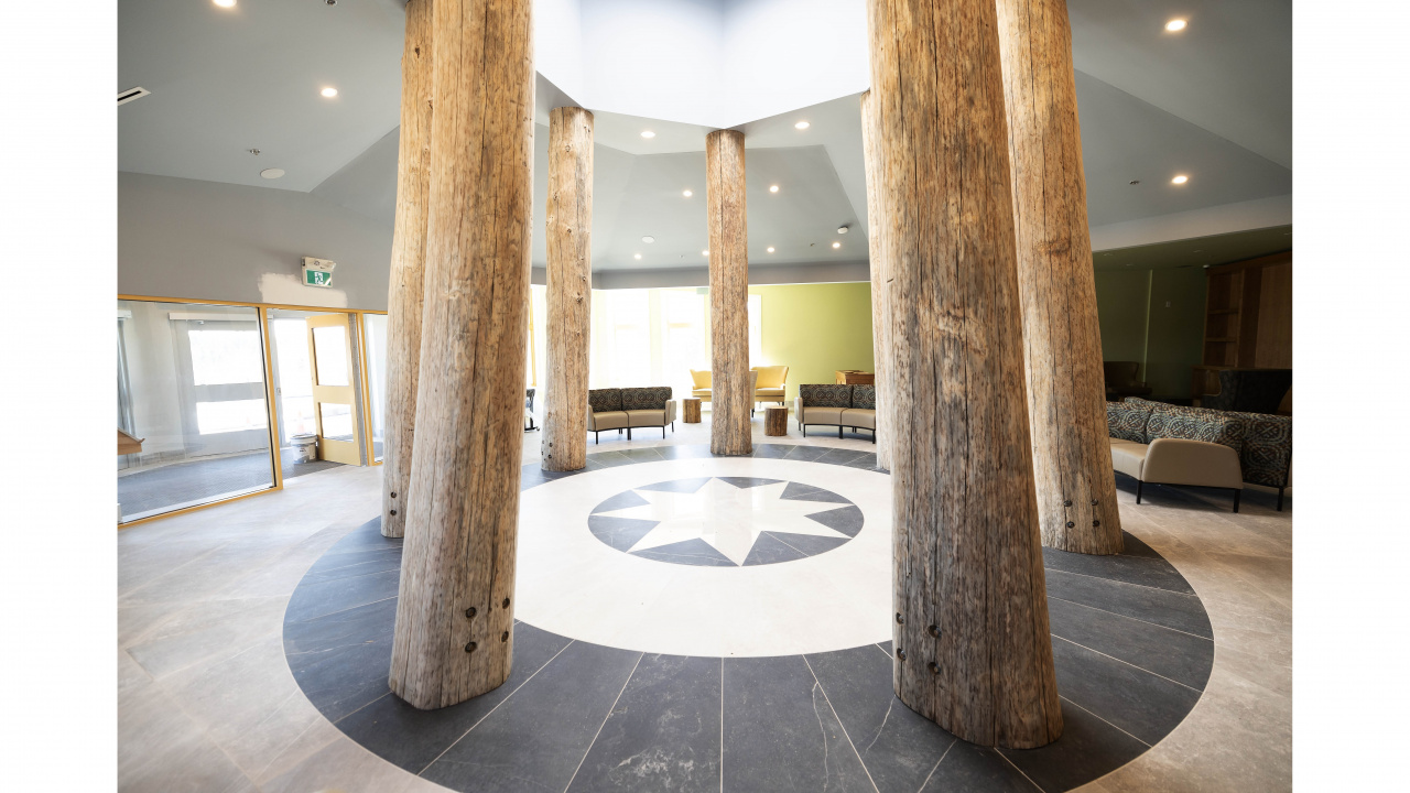 Photo of poles and representation of healing circle in gathering area at Kiknu long-term care home