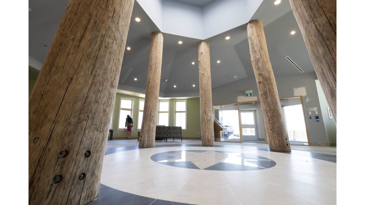 Photo of poles and representation of healing circle in gathering area at Kiknu long-term care home