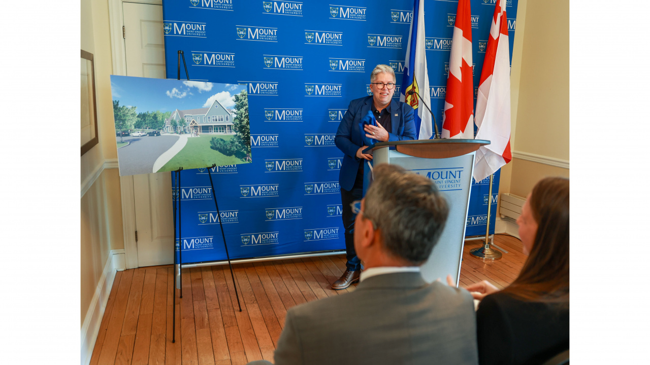 Photo of MSVU President Joël Dickinson at a podium