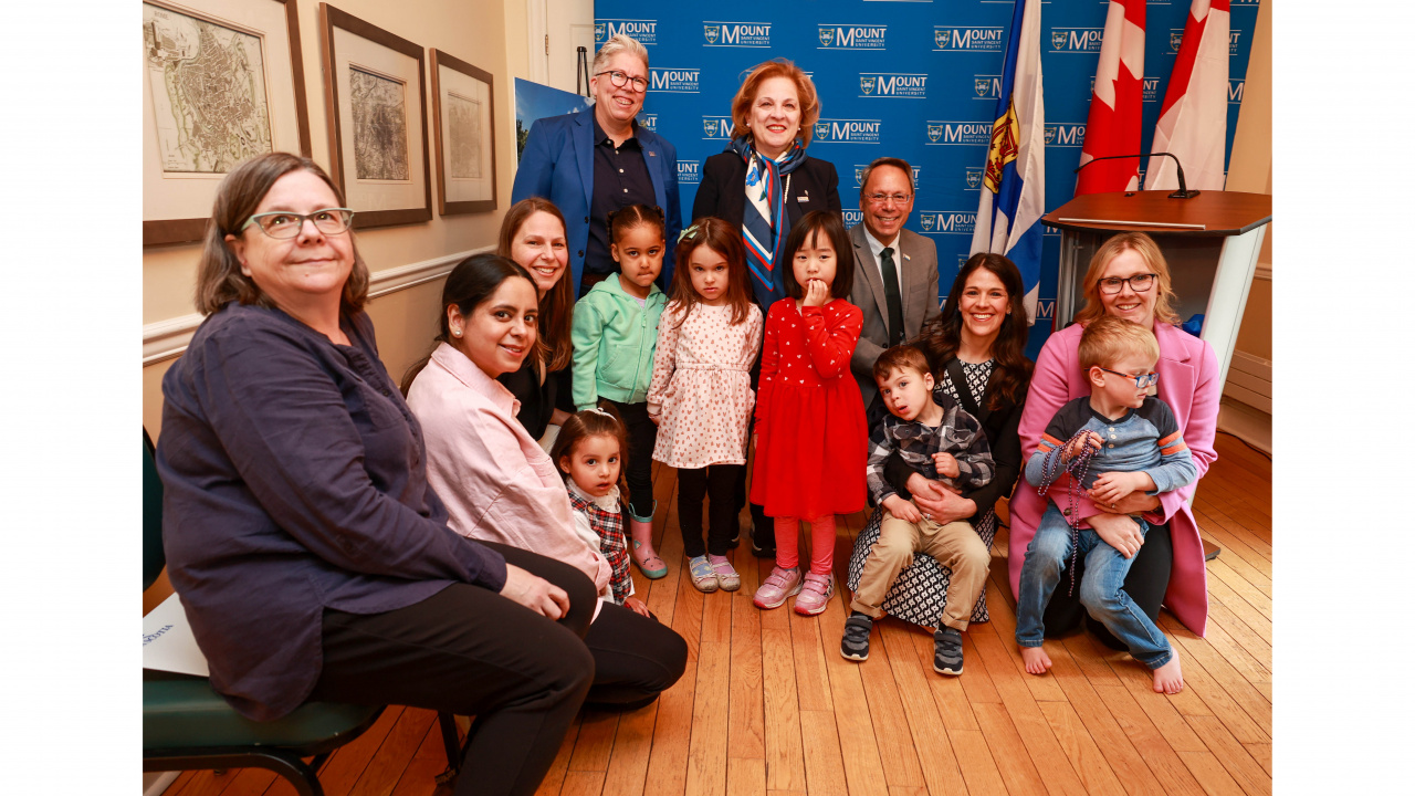 Photo of ministers and children after a child-care facility expansion announcement
