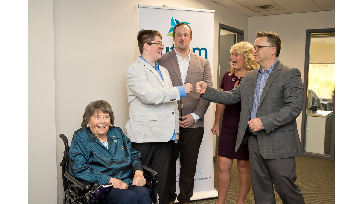 Photo of Joan Craig, founder of Autism Nova Scotia; Ethan Rekunyk, who has autism and is an advocate; Brian Comer, Minister of Addictions and Mental Health; Cynthia Carroll, Executive Director, Autism Nova Scotia; and Brendan Maguire, Minister of Community Services