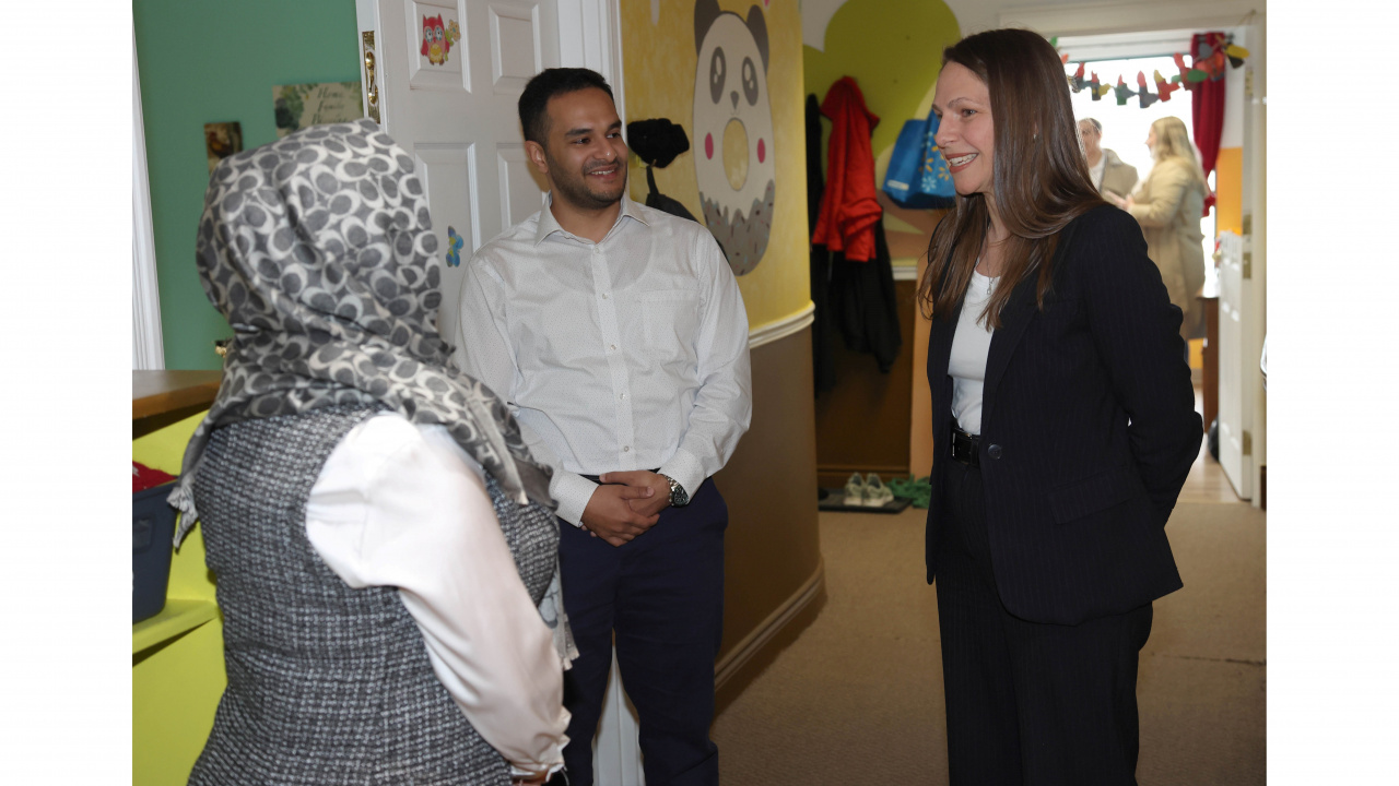 Photo of Education and Early Childhood Development Minister Becky Druhan talking to two people